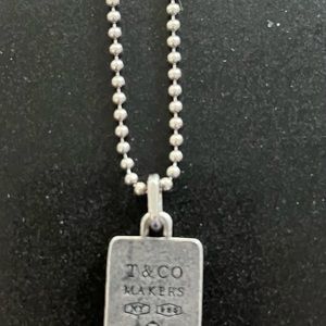Mens Tiffany and Co sterling silver pendant necklace. 24 inch chain.